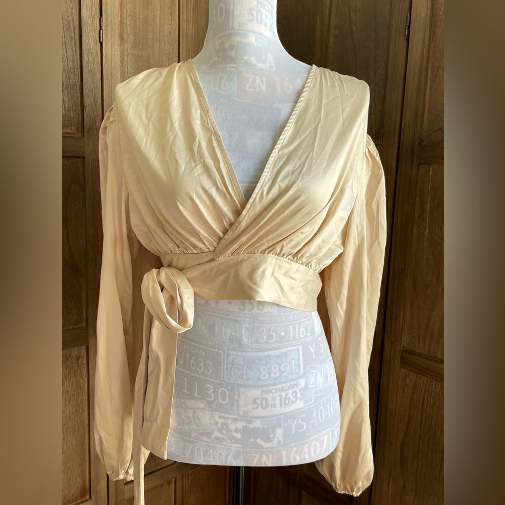 NWT. Women’s crop wrap around satin blouse.
